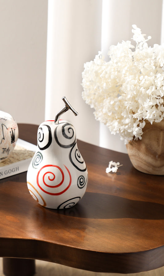 Vibrant pear adorned with colourful swirls I Styling piece