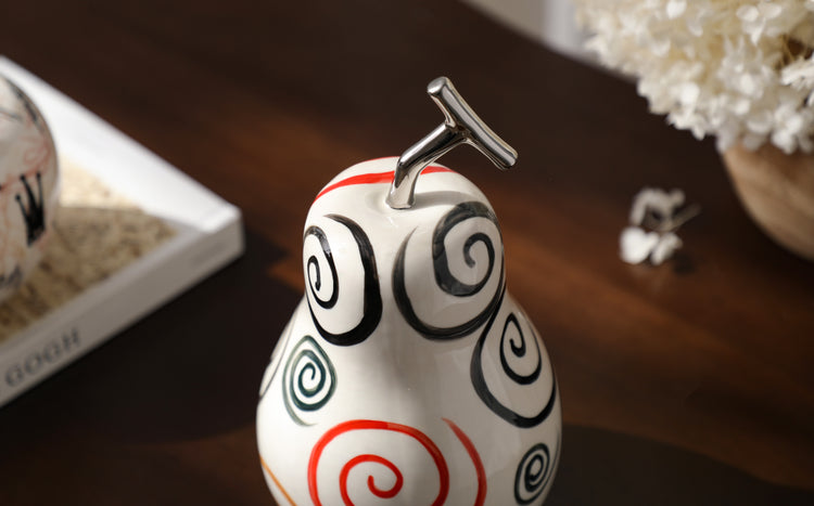Vibrant pear adorned with colourful swirls I Styling piece